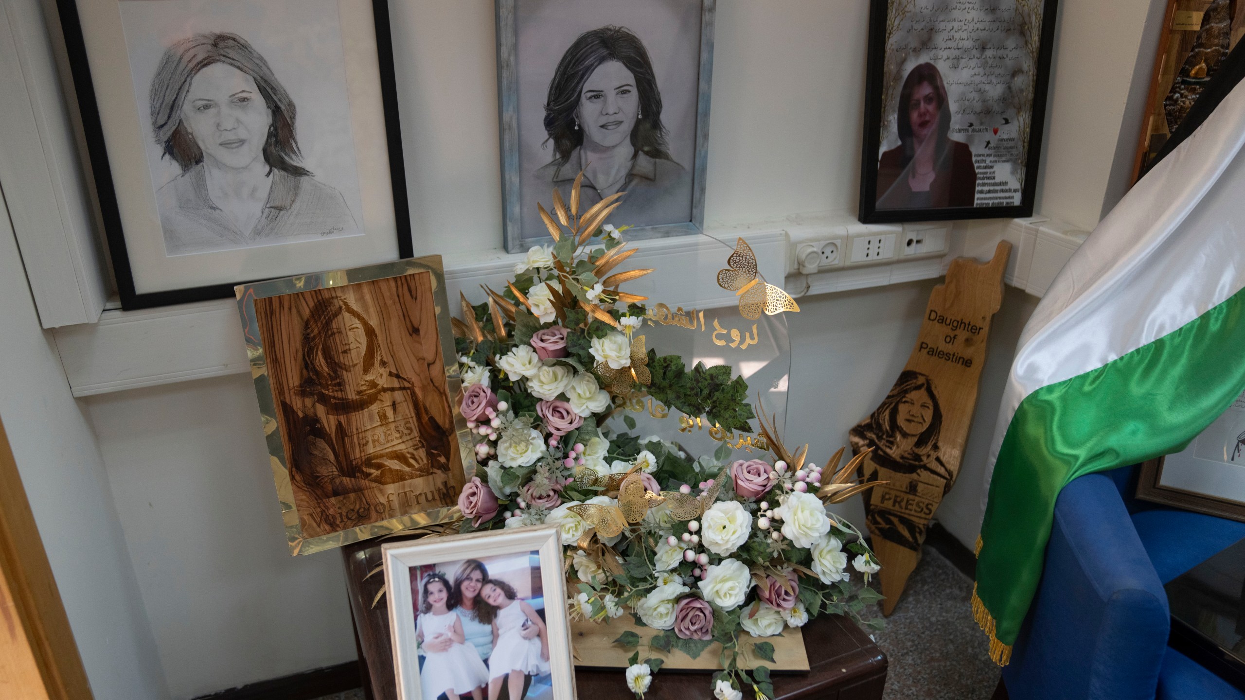 A corner is dedicated for late Al Jazeera network journalist Shireen Abu Akleh inside the network's office, in the West Bank city of Ramallah Sunday, May 5, 2024. Israel ordered the local offices of Qatar's Al Jazeera satellite news network to close Sunday, escalating a long-running feud between the broadcaster and Prime Minister Benjamin Netanyahu's hard-line government as Doha-mediated cease-fire negotiations with Hamas hang in the balance. (AP Photo/Nasser Nasser)