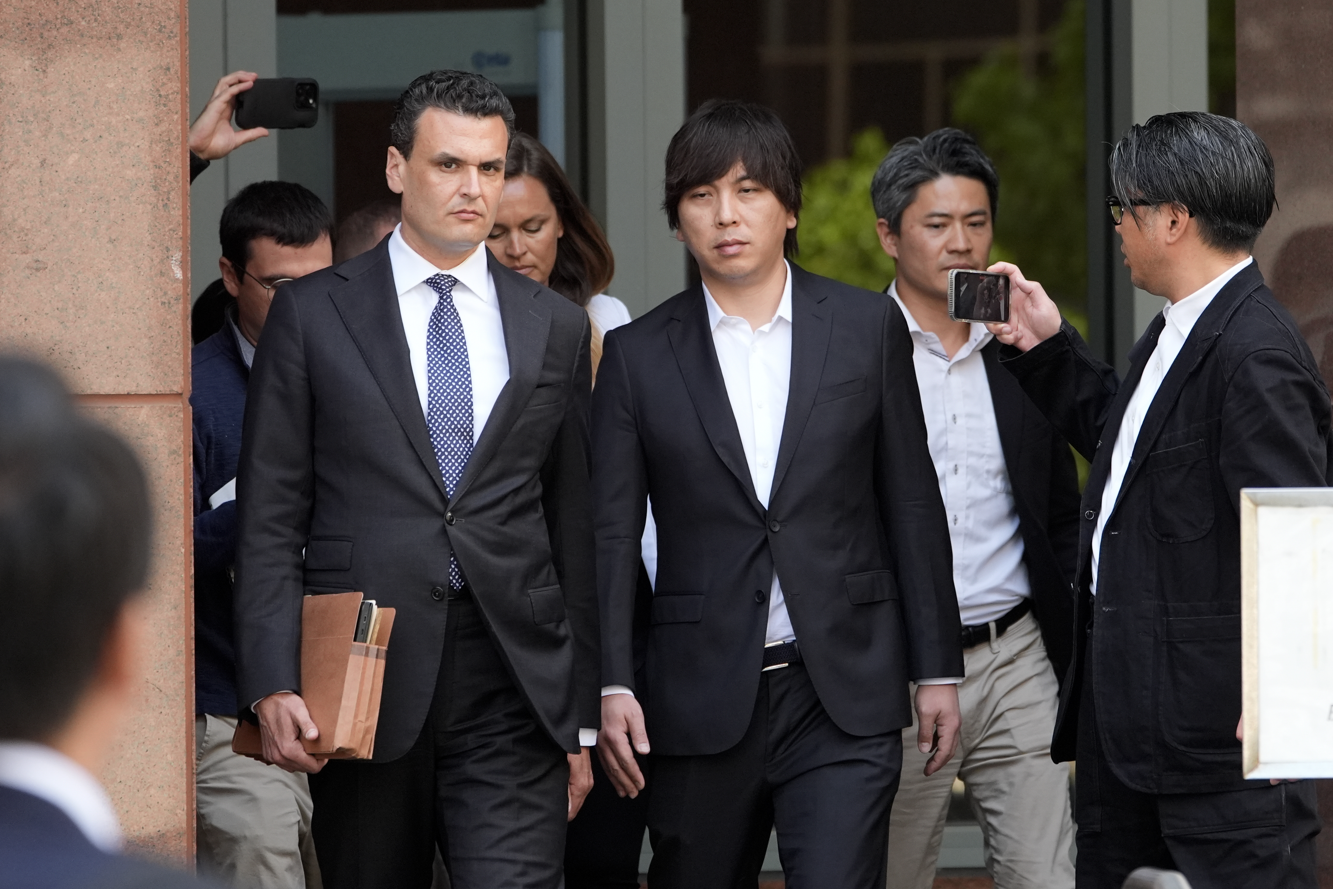 Ippei Mizuhara, the former longtime interpreter for the Los Angeles Dodgers baseball star Shohei Ohtani, leaves federal court following his arraignment, Tuesday, May 14, 2024 in Los Angeles. (AP Photo/Damian Dovarganes)