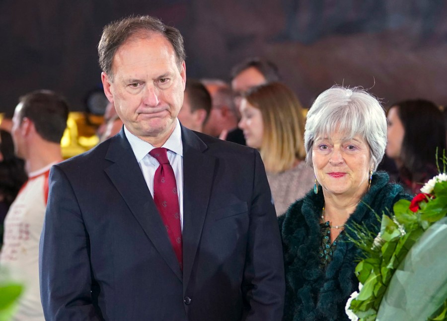 FILE - Supreme Court Justice Samuel Alito Jr., left, and his wife Martha-Ann Alito, pay their respects at the casket of Reverend Billy Graham at the Rotunda of the U.S. Capitol Building in Washington, Feb. 28, 2018. An upside-down American flag was displayed outside of Alito's home Jan. 17, 2021, days after former President Donald Trump supporters stormed the U.S. Capitol, The New York Times reports. It's a symbol associated with Trump's false claims of election fraud. "It was briefly placed by Mrs. Alito in response to a neighbor's use of objectionable and personally insulting language on yard signs," Alito said in an emailed statement to the newspaper. (AP Photo/Pablo Martinez Monsivais, File)