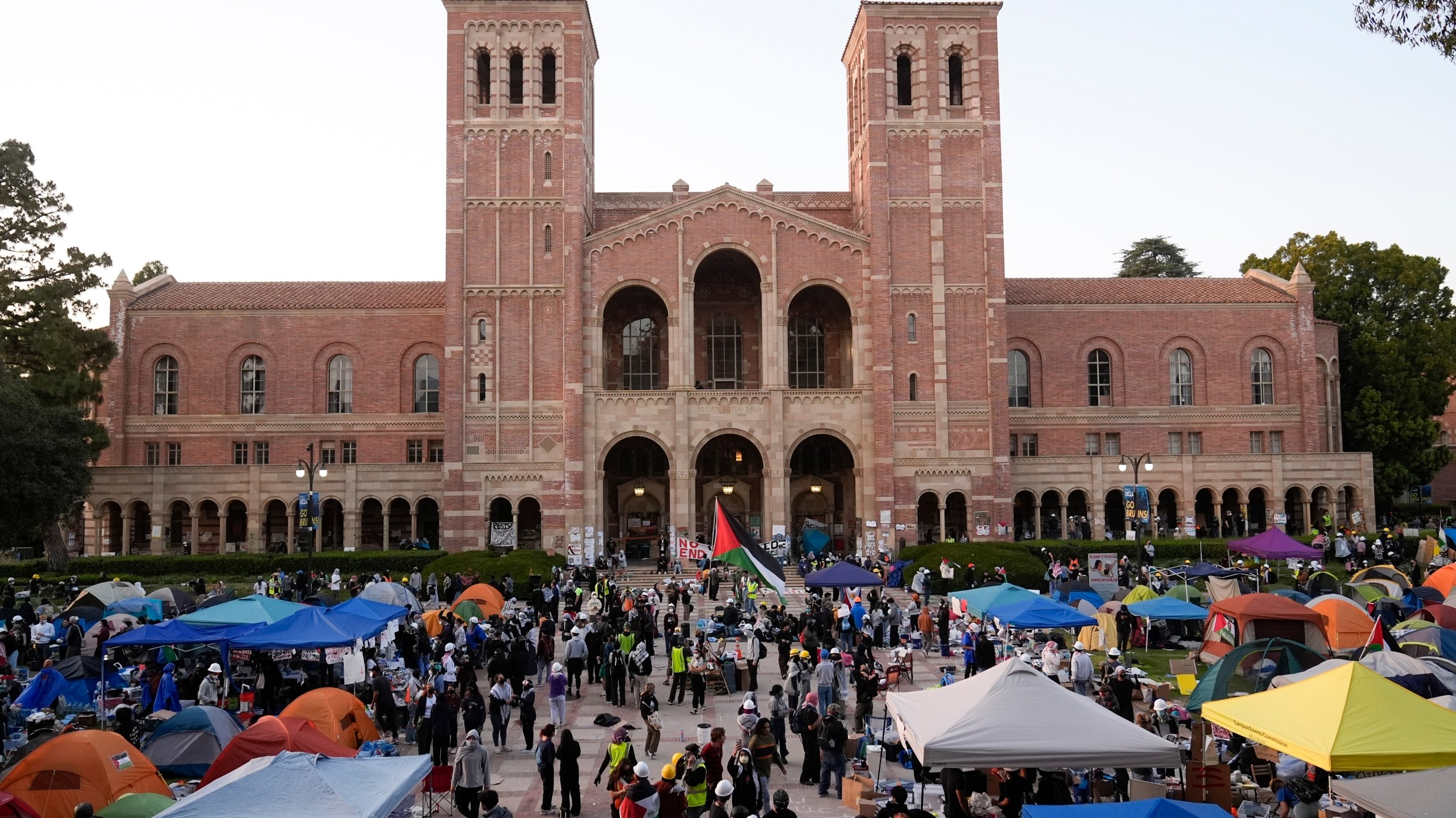 FILE - Demonstrators walk in an encampment on the UCLA campus after clashes between pro-Israel and pro-Palestinian groups, Wednesday, May 1, 2024, in Los Angeles. Leaders from Northwestern University, the University of California, Los Angeles, and Rutgers University are expected to testify before Congress on Thursday, the latest in a series of hearings spearheaded by House Republicans into how colleges have responded to pro-Palestinian protests on their campuses. (AP Photo/Jae C. Hong, file)