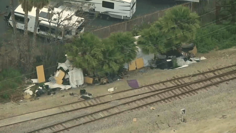 Signs of a homeless encampment are seen outside of Mike Thompson's RV Supercenter in Santa Fe Springs on May 9, 2024.