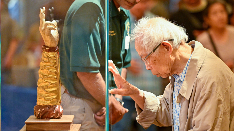 Duan Nguyen visits the relic of St. Jude Thaddeus on display at Santiago de Compostela Catholic Church in Lake Forest, CA, on Monday, April 29, 2024.