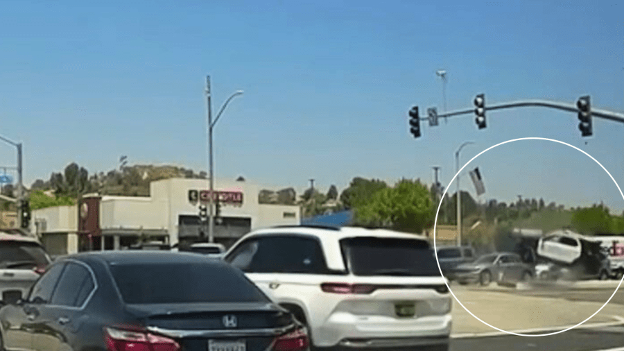 Dashcam video captured the moment a crash sent a deputy's vehicle barreling into a busy intersection in Santa Clarita on May 29, 2024. (@whatsupscv)