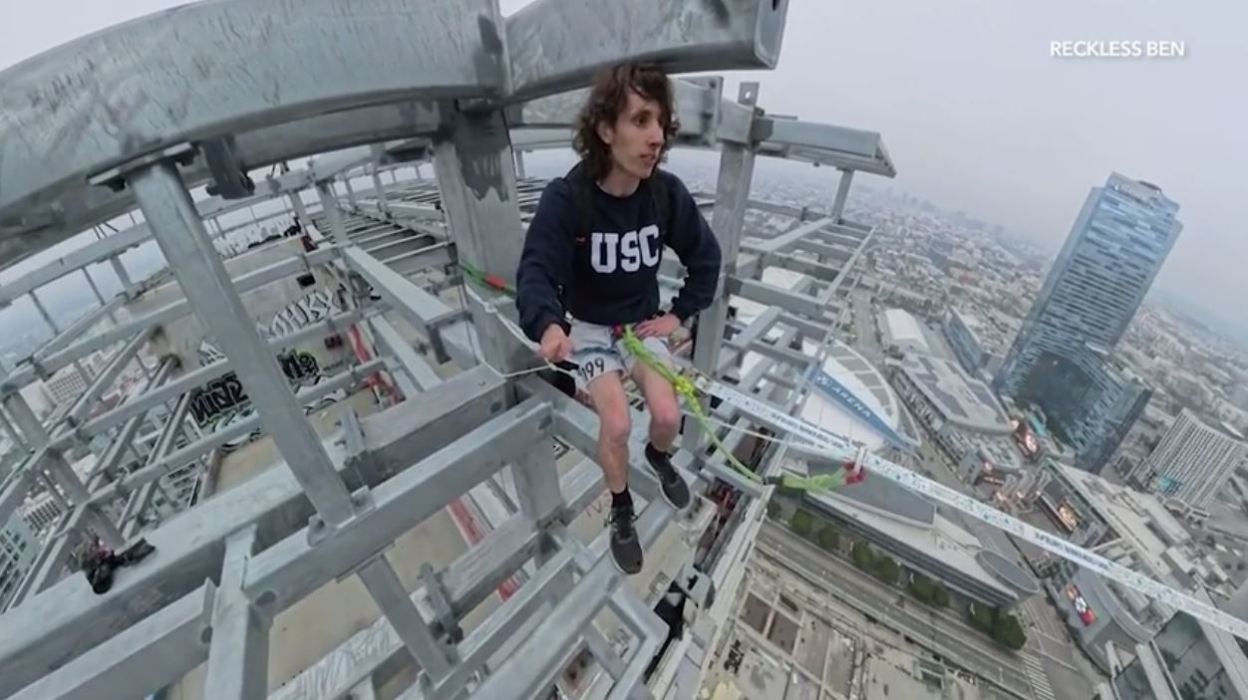 YouTube daredevil and performance artist Ben Schneider is seen walking a small rope tied between two skyscrapers in downtown Los Angeles on May 12, 2024. (Ben Schneider)