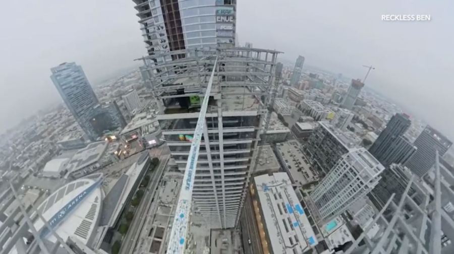 YouTube daredevil and performance artist Ben Schneider is seen walking a small rope tied between two skyscrapers in downtown Los Angeles on May 12, 2024. (Ben Schneider)