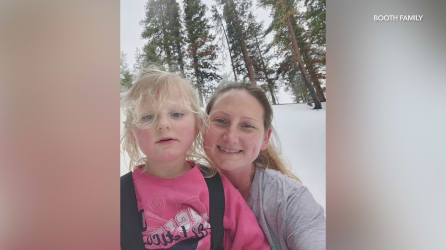 Alli and Elisabeth Booth, 7, are seen together in a family photo. (Booth Family)