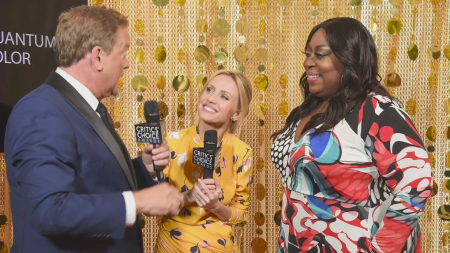 Jessica Holmes and Sam Rubin reporting from the red carpet. (KTLA)