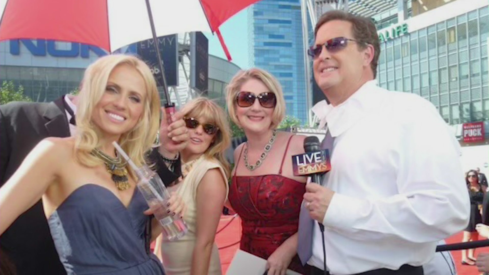 Jessica Holmes and Sam Rubin reporting from the red carpet. (KTLA)