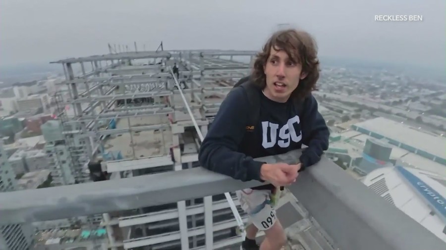 YouTube daredevil and performance artist Ben Schneider is seen walking a small rope tied between two skyscrapers in downtown Los Angeles on May 12, 2024. (Ben Schneider)