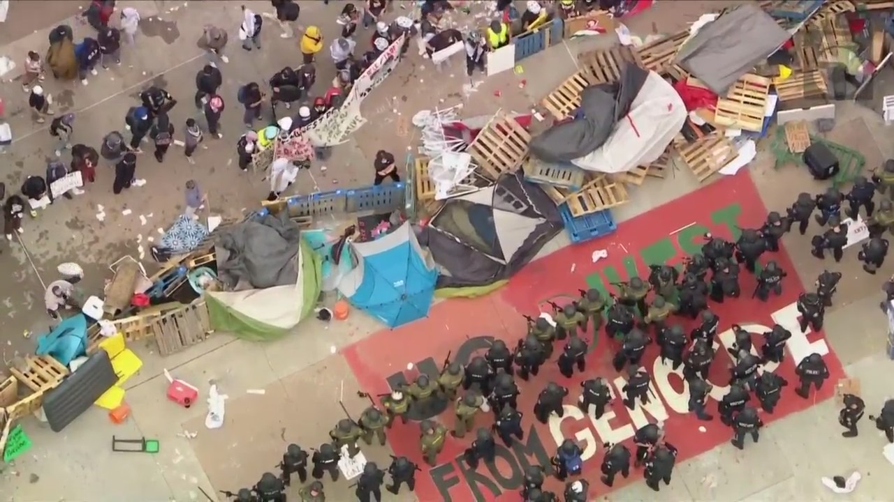 Law enforcement officers are seen dismantling a pro-Palestinian protest encampment at UC Irvine on May 15, 2024. (KTLA)