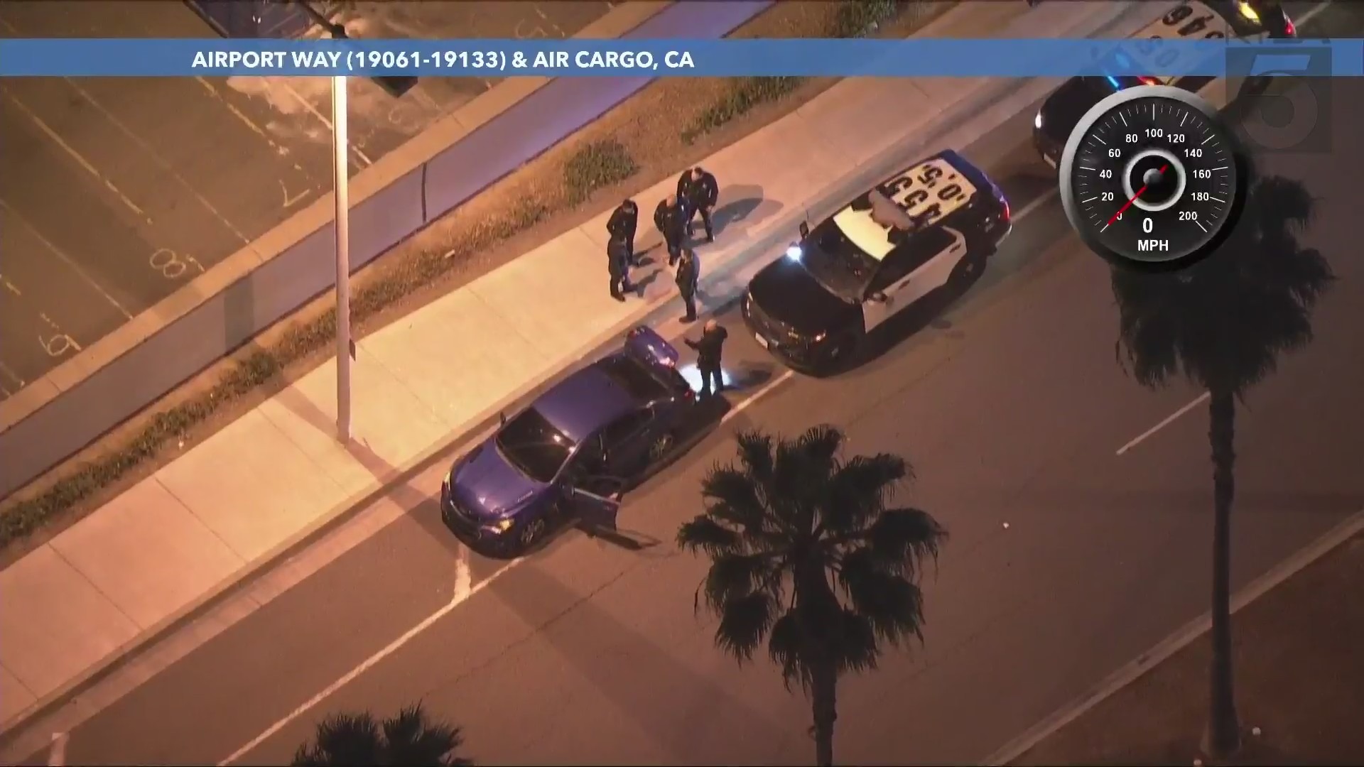 Officers investigated the suspects' blue sedan on a side street after multiple passengers were arrested at John Wayne Airport in Santa Ana on May 24, 2024. (KTLA)