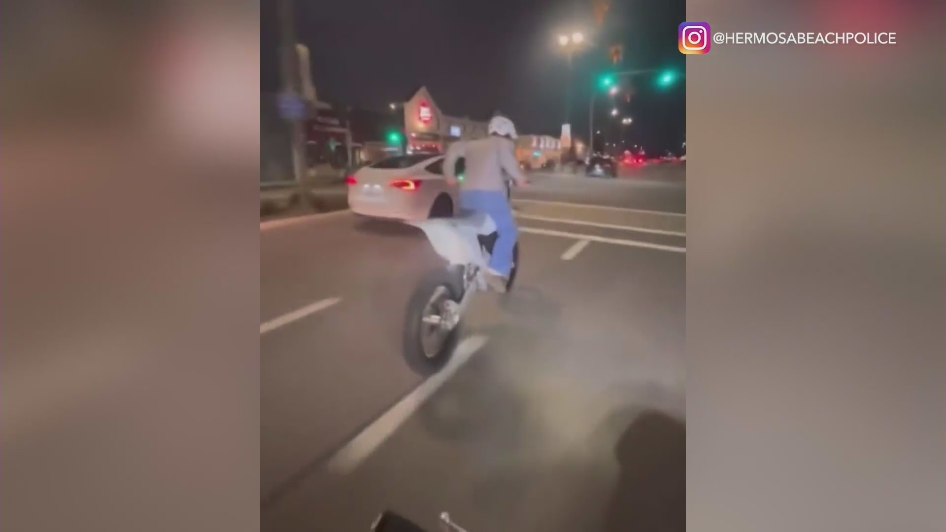 A biker riding recklessly, creating skidmarks on a busy road in Hermosa Beach. (Hermosa Beach Police Department)