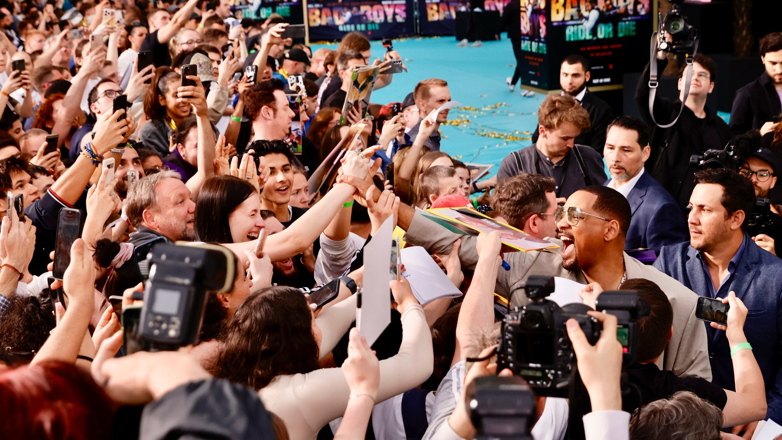 Actor Will Smith meets fans as he attends the European premiere of the film "Bad Boys: Ride or Die" at the Zoo Palast in Berlin, Monday May 27, 2024. (Carsten Koall/dpa via AP)