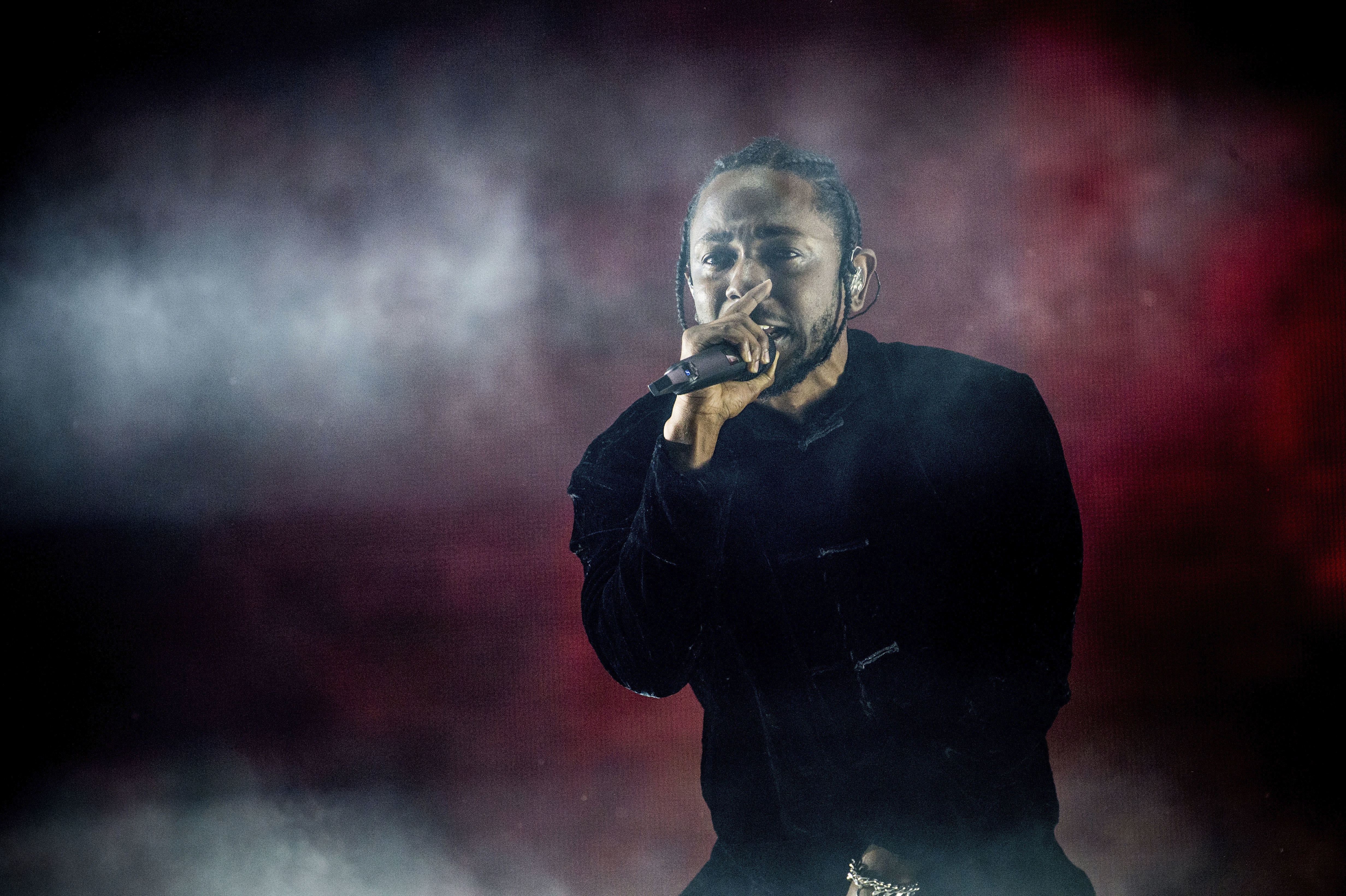FILE - Kendrick Lamar performs at Coachella Music & Arts Festival at the Empire Polo Club on Sunday, April 16, 2017, in Indio, Calif. Kendrick Lamar turned his Juneteenth “Pop Out” concert into a celebration of Los Angeles unity. The 37-year-old rapper curated a three-hour livestreamed concert featuring a mix of up-and-coming LA rappers and stars including Dr. Dre and Tyler, The Creator. (Photo by Amy Harris/Invision/AP, File)