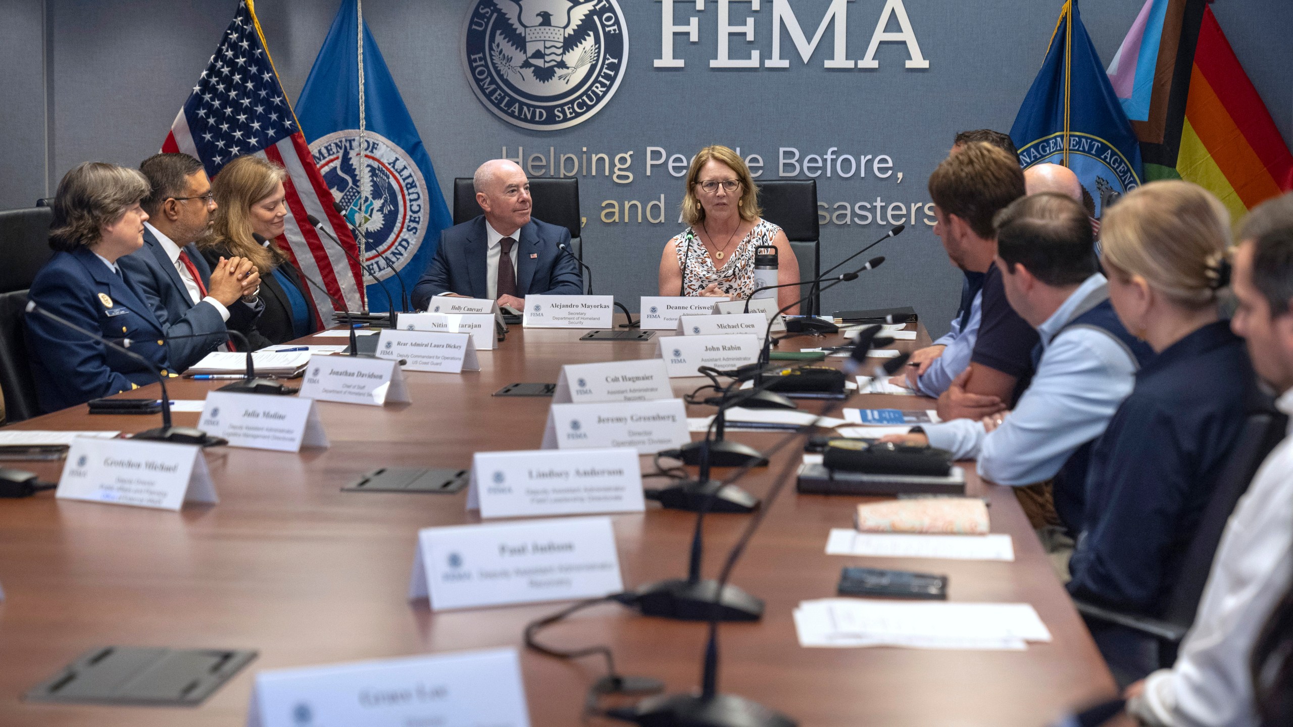 Homeland Security Secretary Alejandro Mayorkas, center left, listens as Federal Emergency Management Agency administrator Deanne Criswell speaks during a briefing on the 2024 hurricane and wildfire outlook at FEMA headquarters on Friday, June 21, 2024, in Washington. (AP Photo/Mark Schiefelbein)