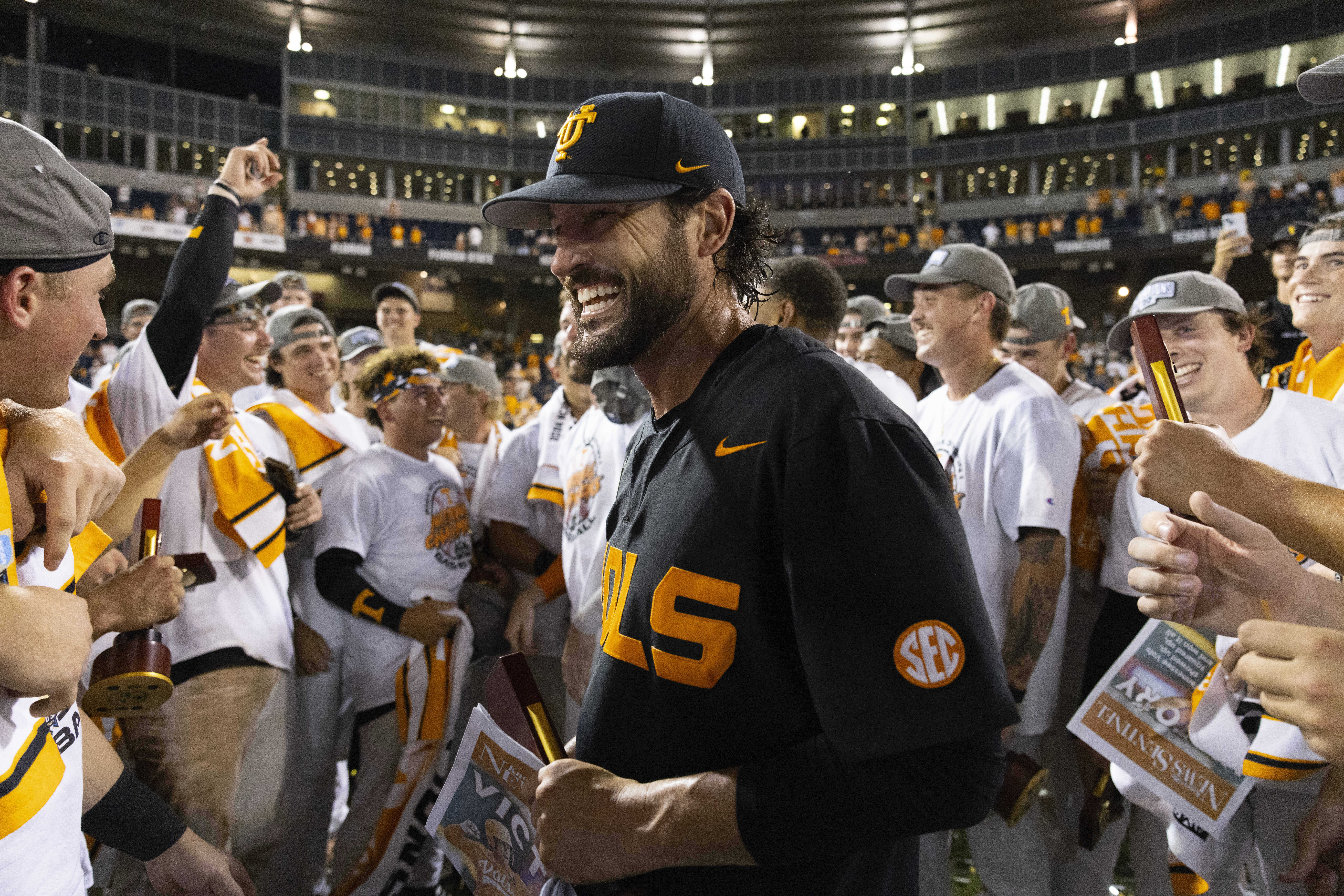 Tennessee coach Tony Vitello, center, celebrates with his team following their victory over Texas A&M in Game 3 of the NCAA College World Series baseball finals in Omaha, Neb., Monday, June 24, 2024. (AP Photo/Rebecca S. Gratz)