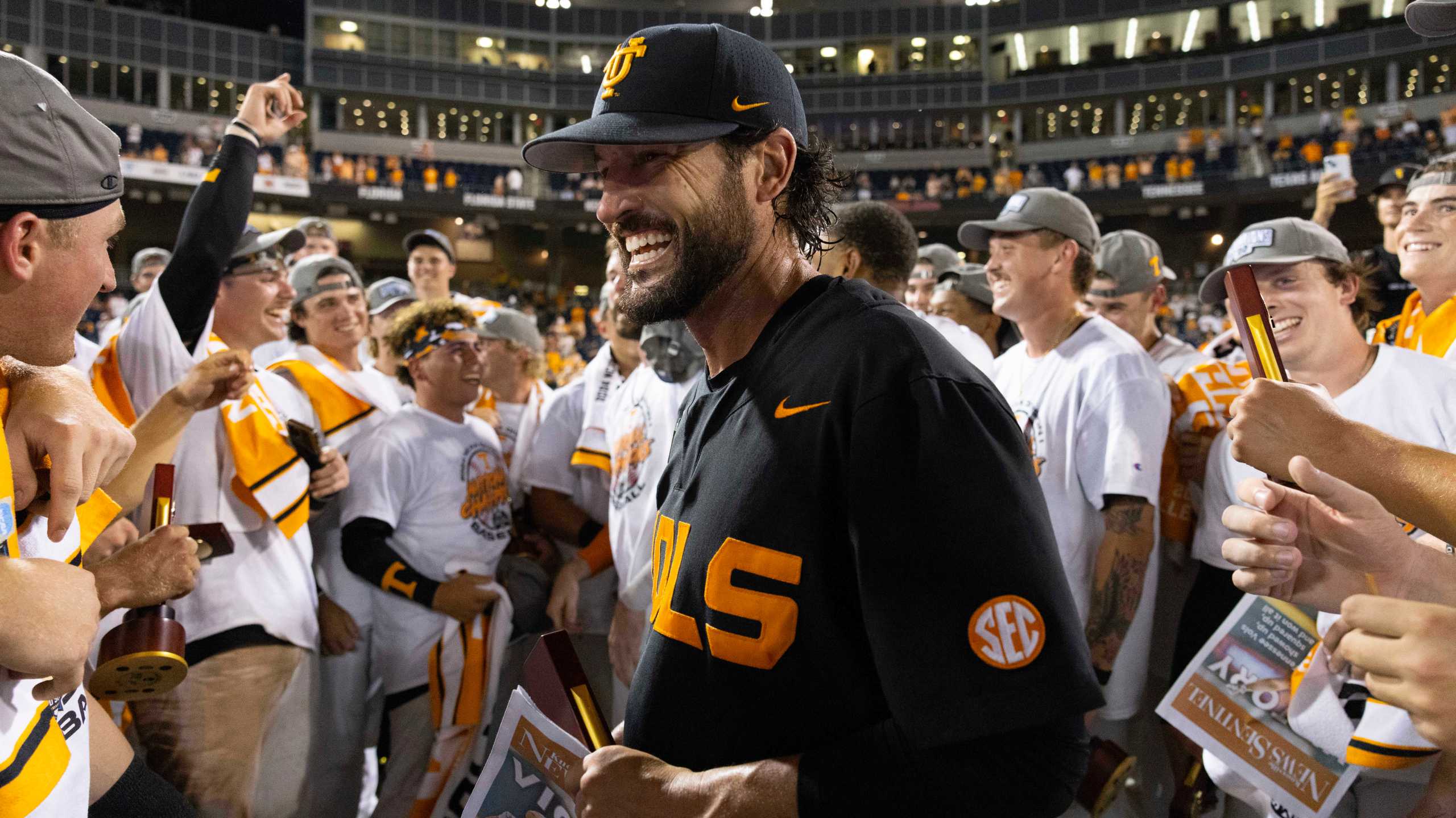 Tennessee coach Tony Vitello, center, celebrates with his team following their victory over Texas A&M in Game 3 of the NCAA College World Series baseball finals in Omaha, Neb., Monday, June 24, 2024. (AP Photo/Rebecca S. Gratz)