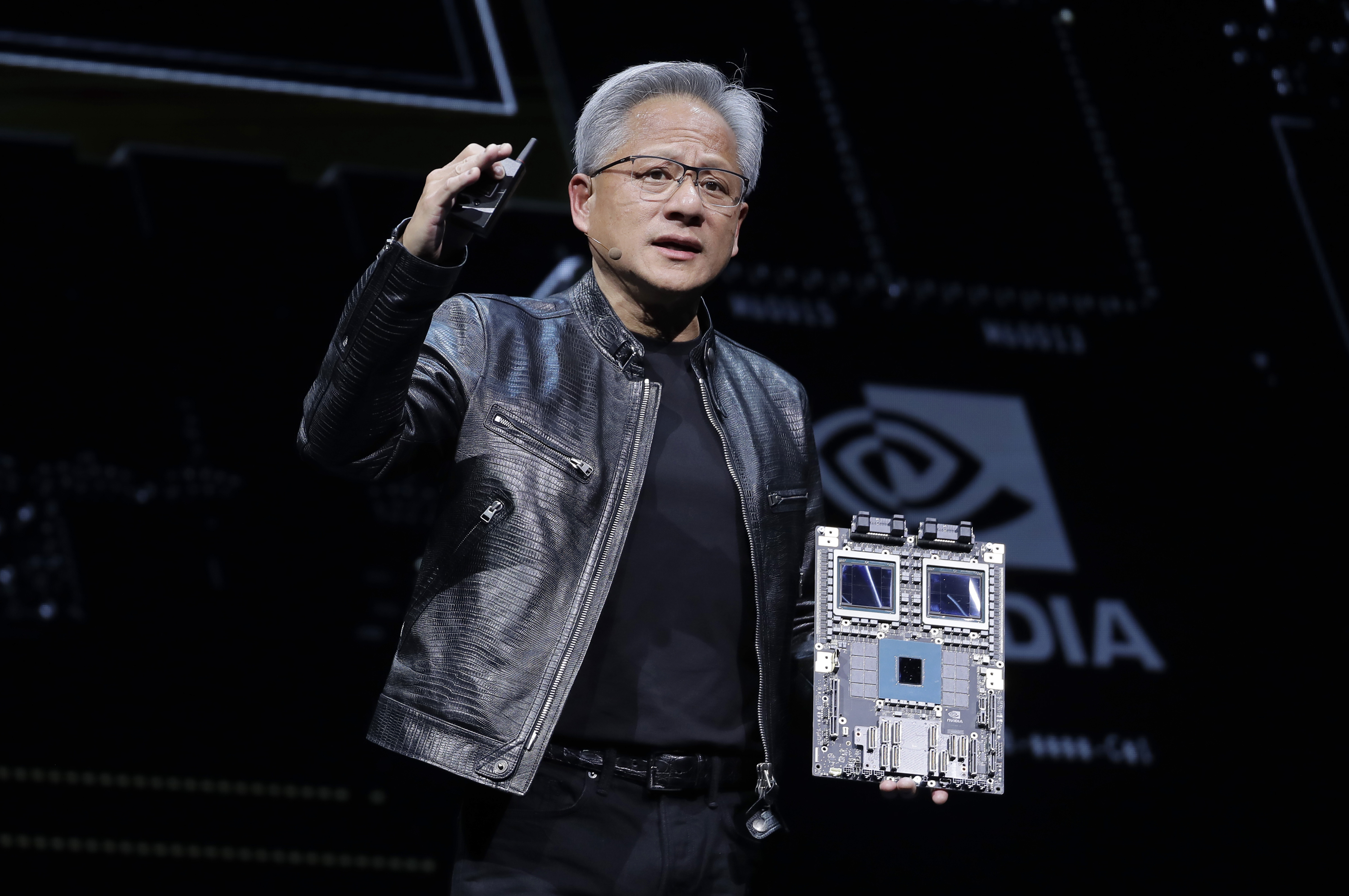FILE - President and CEO of Nvidia Corporation Jensen Huang delivers a speech during the Computex 2024 exhibition in Taipei, Taiwan, June 2, 2024. A rebound for Nvidia on Tuesday, June 25, 2024, is helping keep U.S. indexes close to their records Tuesday. (AP Photo/Chiang Ying-ying)