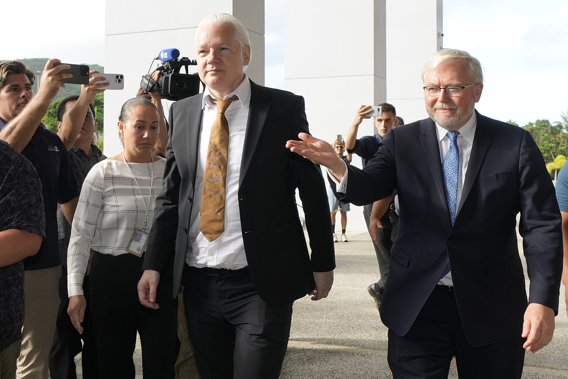 WikiLeaks founder Julian Assange, center, arrives at the United States courthouse where he is expected enter a plea deal in Saipan, Mariana Islands, Wednesday, June 26, 2024. (AP Photo/Eugene Hoshiko)