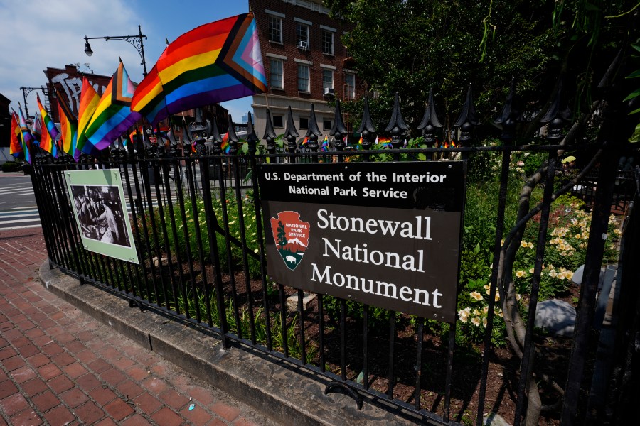 A National Park Service sign marks the Stonewall National Monument outside the Stonewall Inn, Monday, June 17, 2024, in New York. The building will open as the new visitor center for the Stonewall National Monument on Friday, June 28, the anniversary of the 1969 rebellion that helped reshape LGBTQ+ life in the United States. (AP Photo/Pamela Smith)
