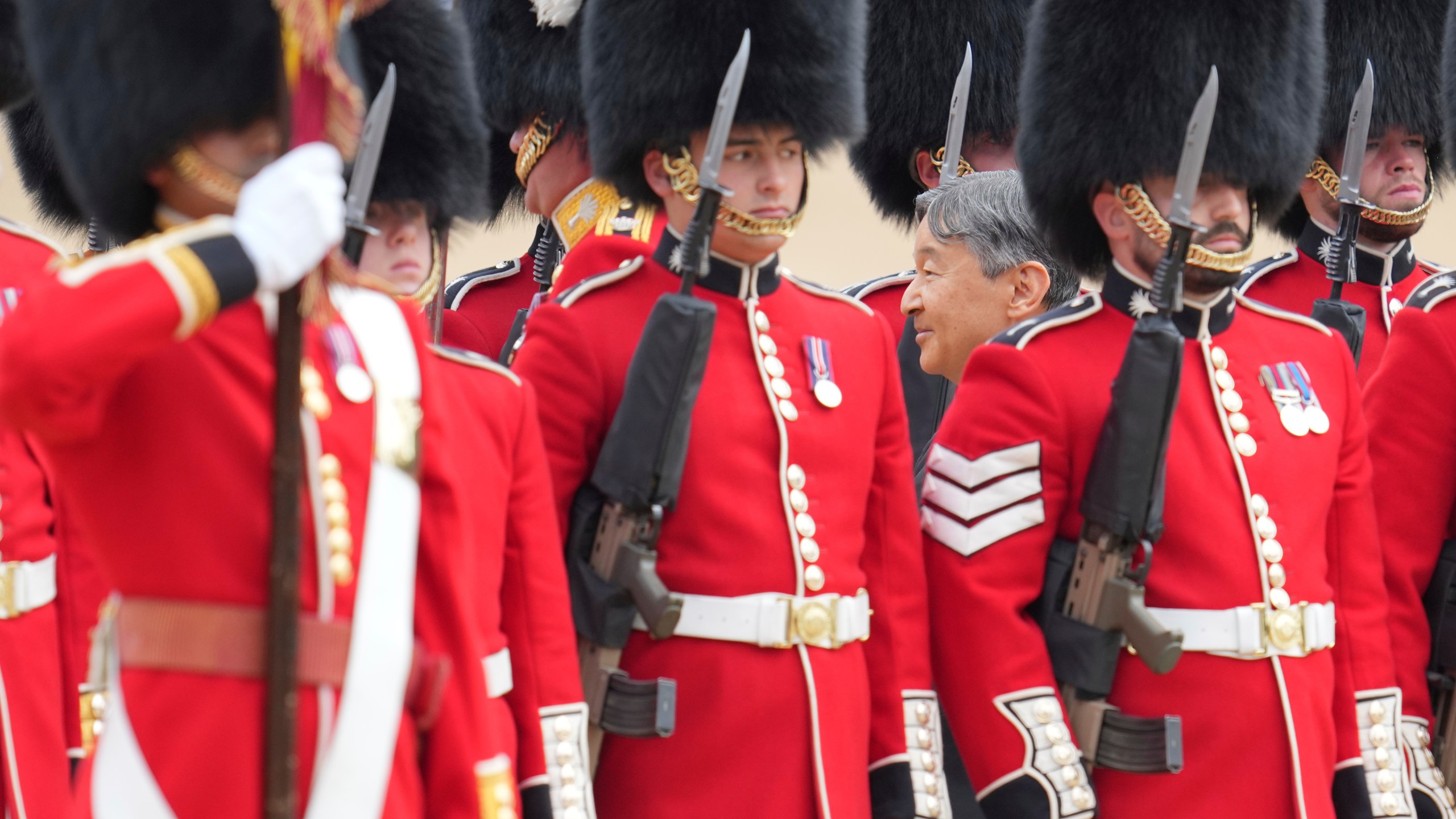 Japans Emperor Naruhito inspects the honour guard on Horse Guards parade during the ceremonial welcome for start of the State Visit to Britain by the Japanese Emperor and Empress, in London, Tuesday, June 25, 2024. (AP Photo/Kin Cheung, Pool)