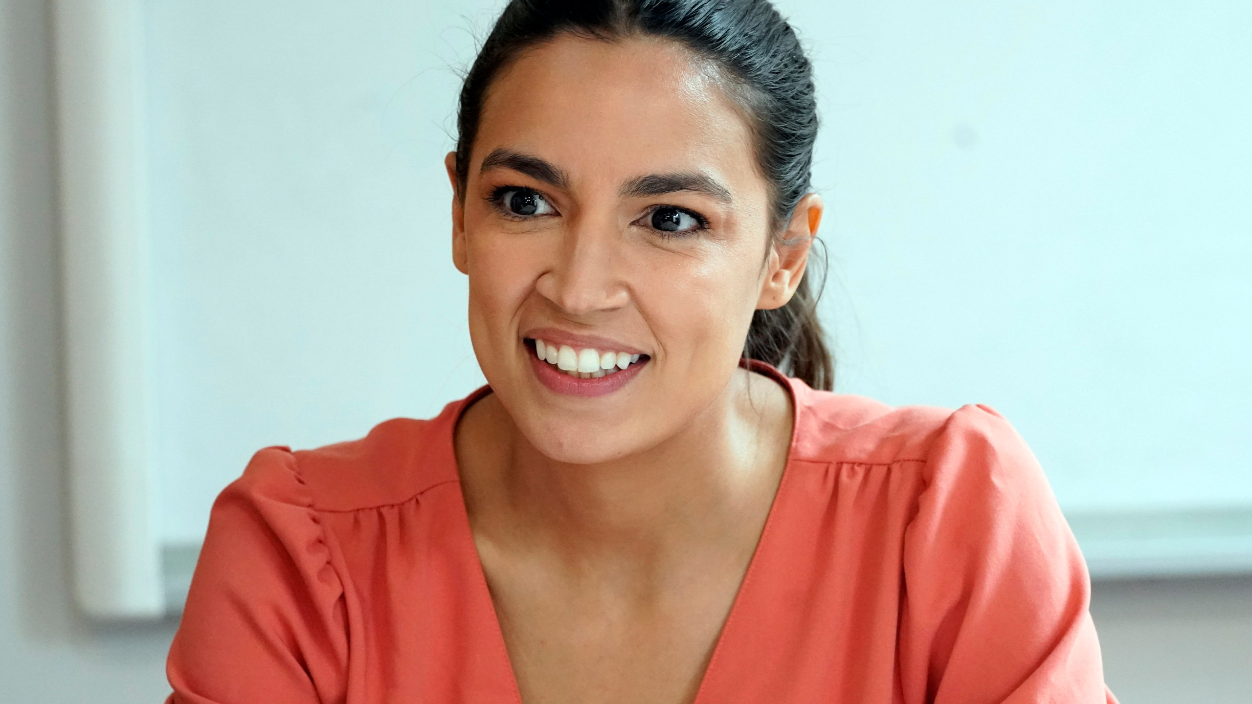 FILE — Rep. Alexandria Ocasio-Cortez, D-N.Y., is seen during a meeting at the Chhaya Community Development Corporation, July 6, 2022, in the Jackson Heights neighborhood of the Queens borough of New York. Ocasio-Cortez is the incumbent candidate for Congress in New York's District 14. (AP Photo/Mary Altaffer, File)