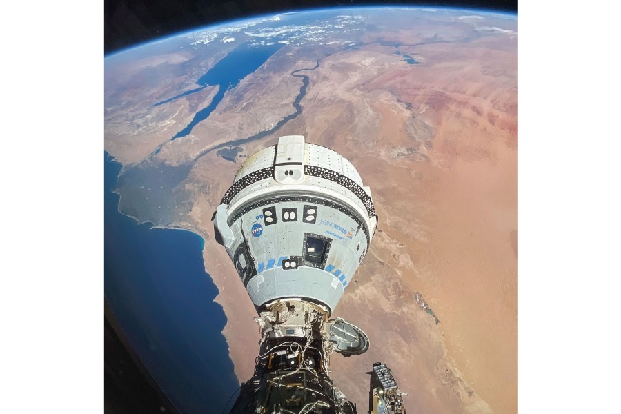 This photo provided by NASA shows the Starliner spacecraft docked to the Harmony module of the International Space Station, orbiting 262 miles above Egypt's Mediterranean coast, on June 13, 2024. (NASA via AP)
