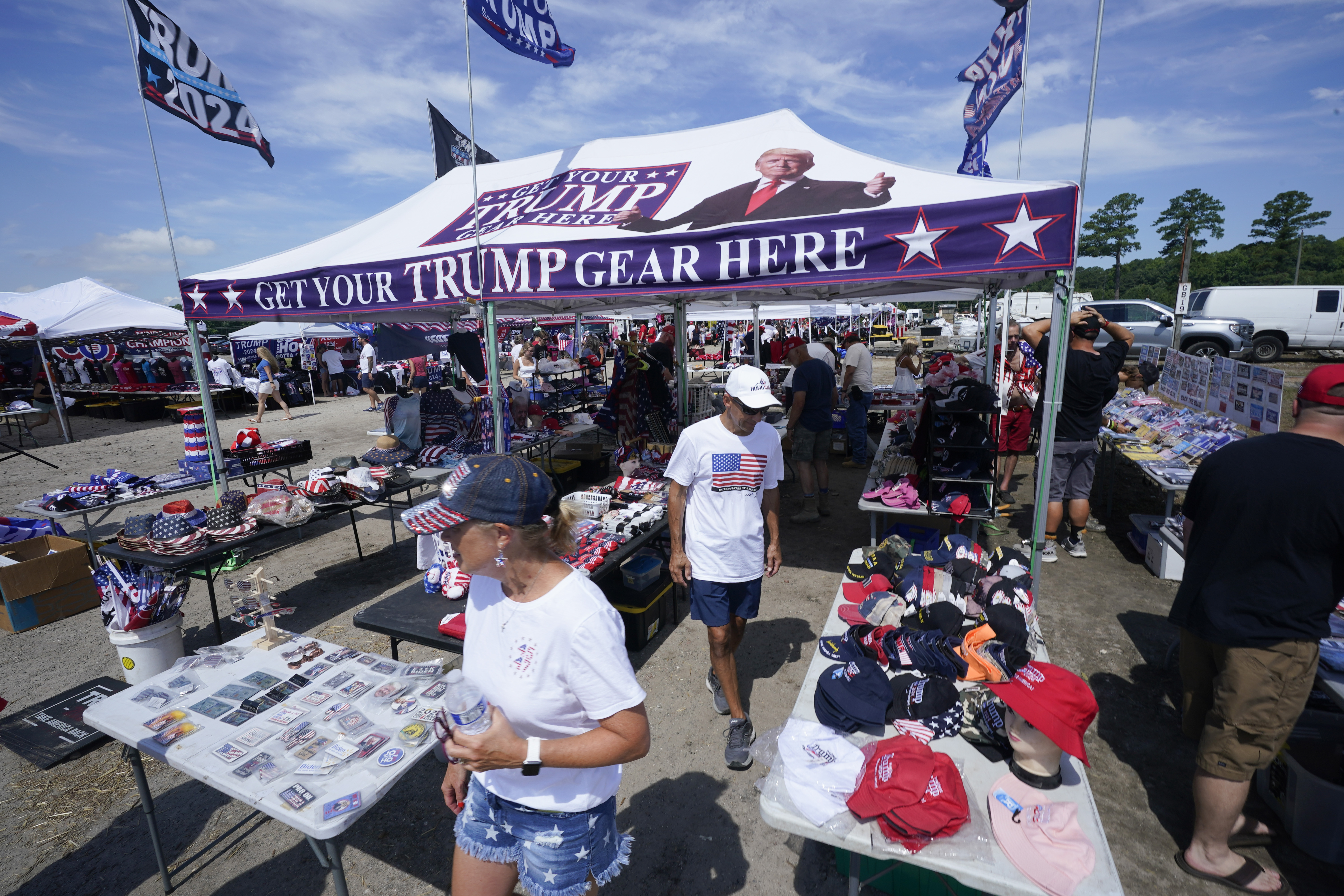 People arrive ahead of a campaign rally for Republican presidential candidate former President Donald Trump in Chesapeake, Va., Friday June 28, 2024. (AP Photo/Steve Helber)