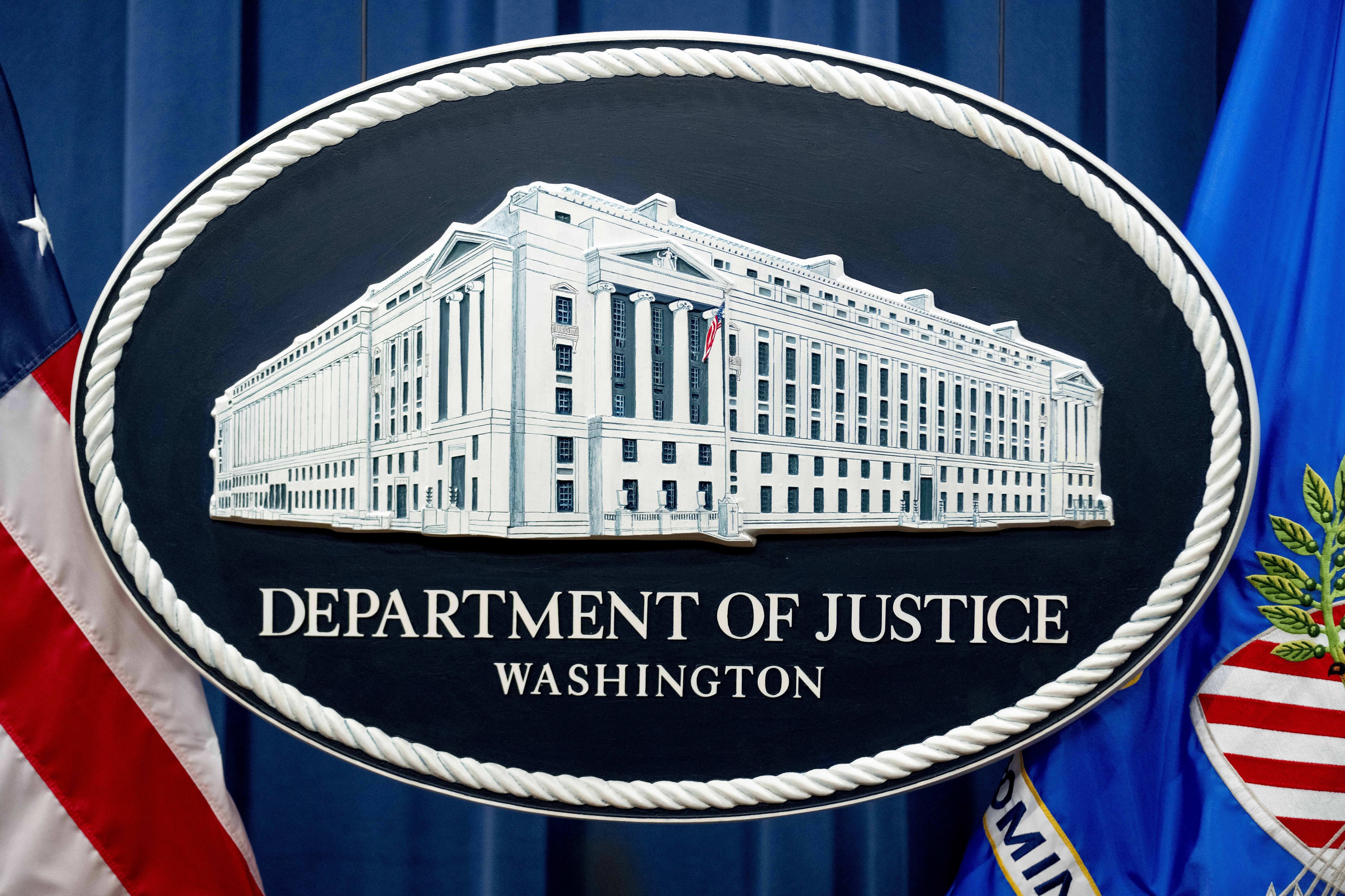 FILE - The U.S. Justice Department sign is seen, Nov. 18, 2022, in Washington. The U.S. Justice Department plans to propose that Boeing plead guilty to fraud in connection with two deadly plane crashes involving its 737 Max jetliners, according to two people who heard federal prosecutors detail the offer Sunday, June 30, 2024. (AP Photo/Andrew Harnik, File)
