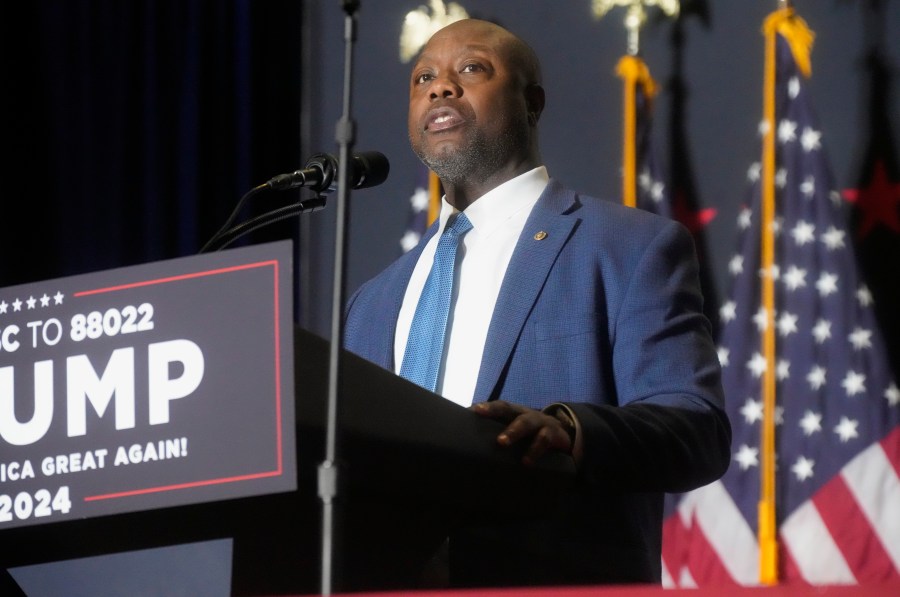 FILE - Sen. Tim Scott, R-S.C., speaks at a campaign rally, Feb. 14, 2024, in North Charleston, S.C. In some cases, Donald Trump's potential vice presidential contenders have had to abandon long-held policy positions and recant vehement criticism. In 2016, Scott excoriated Trump for his reluctance to condemn the Ku Klux Klan, his attacks on a judge's Mexican heritage, and comments equivocating about the 2017 white nationalist rally in Charlottesville, Virginia. (AP Photo/Meg Kinnard, File)