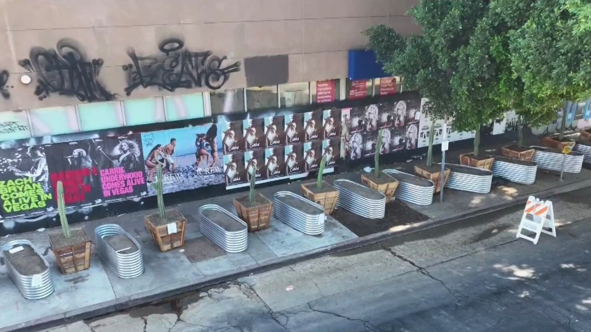 Planters and garden beds placed in front of Hollywood businesses on Sunset Boulevard to deter homeless encampments from growing. (KTLA)