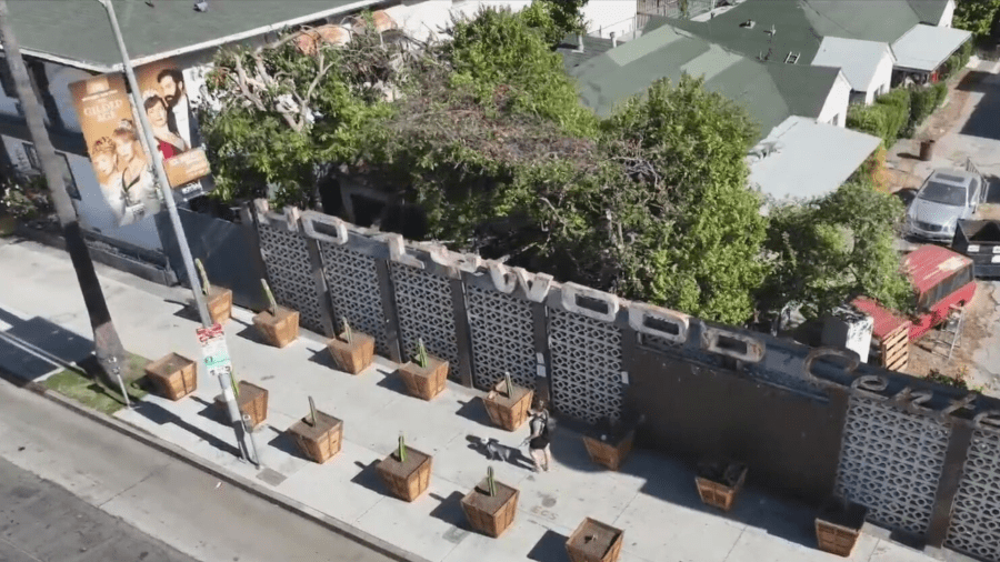 Planters placed in front of Hollywood businesses to deter homeless encampments from growing. (KTLA)