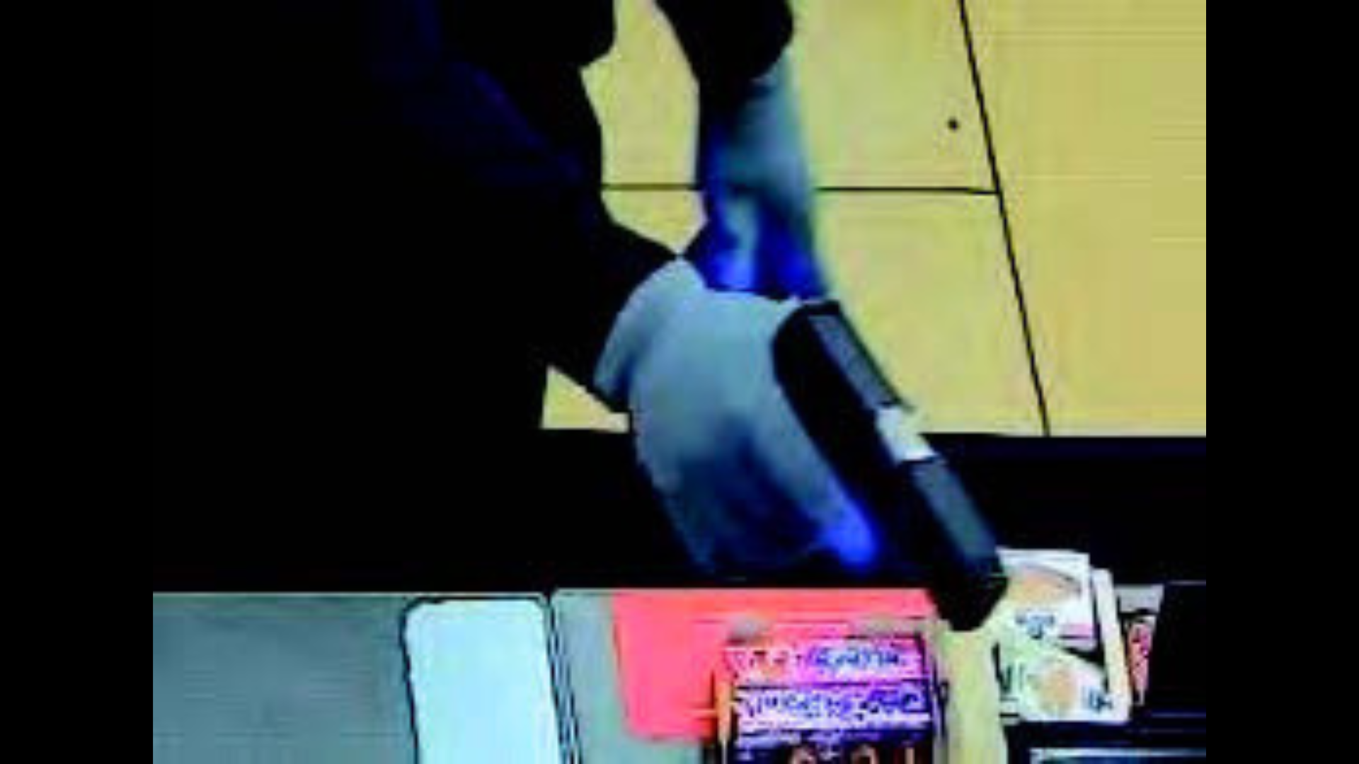 The robbery suspects typically entered stores while masked and hooded while brandishing firearms. (U.S. Attorney’s Office)