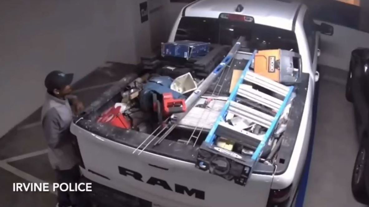 A woman and man seen stealing tools from a pickup truck at an Irvine apartment complex on June 2, 2024. (Irvine Police Department)