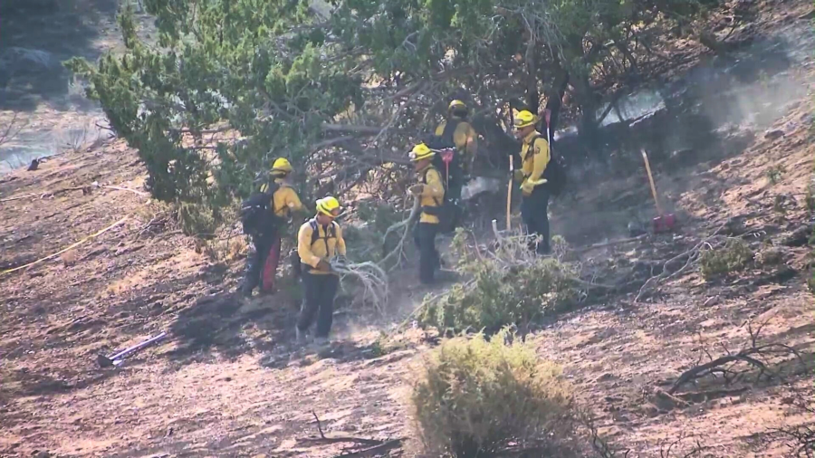 Crews work on a brush fire in Hesperia