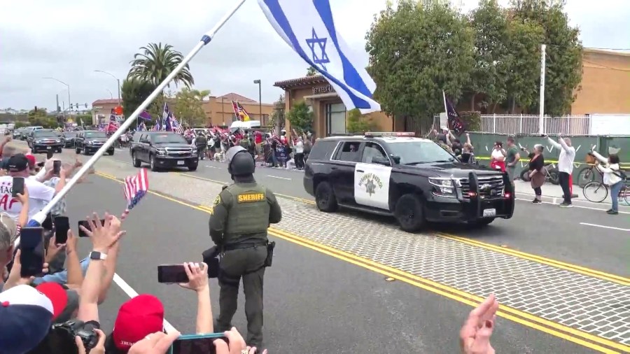 Supporters lined the streets of Newport Beach to await the arrival of Donald Trump's motorcade on June 8, 2024. (KTLA)