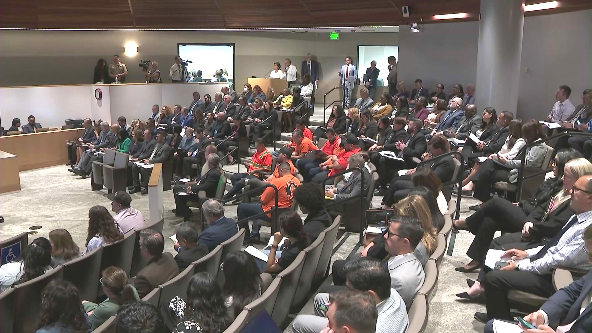 Opponents and ralliers spoke during public comment at a San Bernardino County board hearing over an illegal street vending program on June 11, 2024. (KTLA)