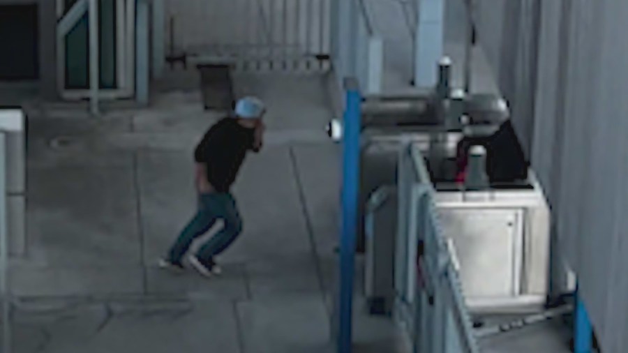 Several men seen covering their face and running underneath the Metro train platform immediately after the Metro train shooting in Baldwin Hills on June 21, 2024.