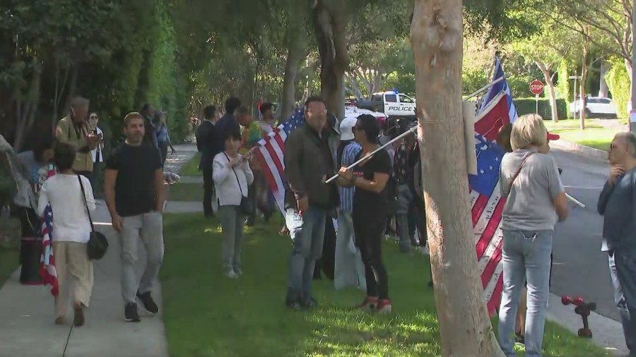 Supporters of Donald Trump await his motorcade's arrival in a Beverly Hills neighborhood on June, 7, 2024. (KTLA)