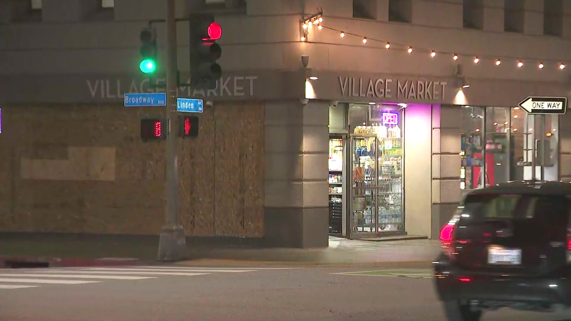 Shop windows were boarded up after a man went on a window-smashing spree in Long Beach's East Village neighborhood on June 6, 2024. (KTLA)