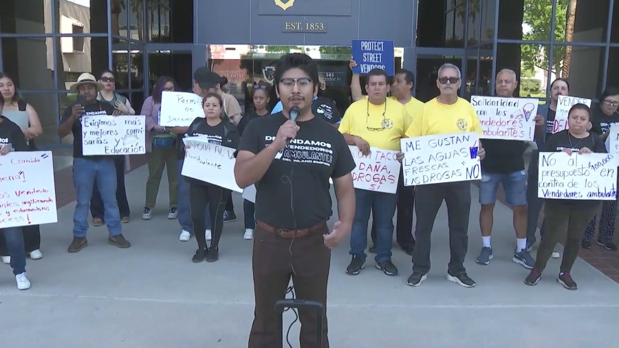 Bryan Sanchez, a lead organizer from the Inland Coalition for Immigrant Justice, held a rally opposing the illegal street vending program in San Bernardino County on June 11, 2024. (KTLA)