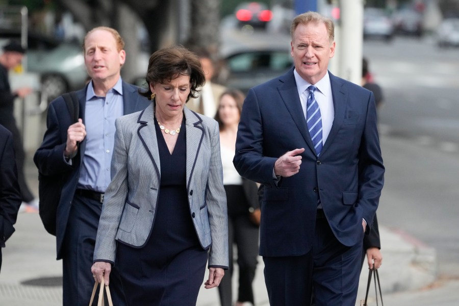 NFL Commissioner Roger Goodell, right, arrives at federal court Monday, June 17, 2024, in Los Angeles. Goodell is expected to testify as a class-action lawsuit filed by "Sunday Ticket" subscribers claiming the NFL broke antitrust laws. (AP Photo/Damian Dovarganes)