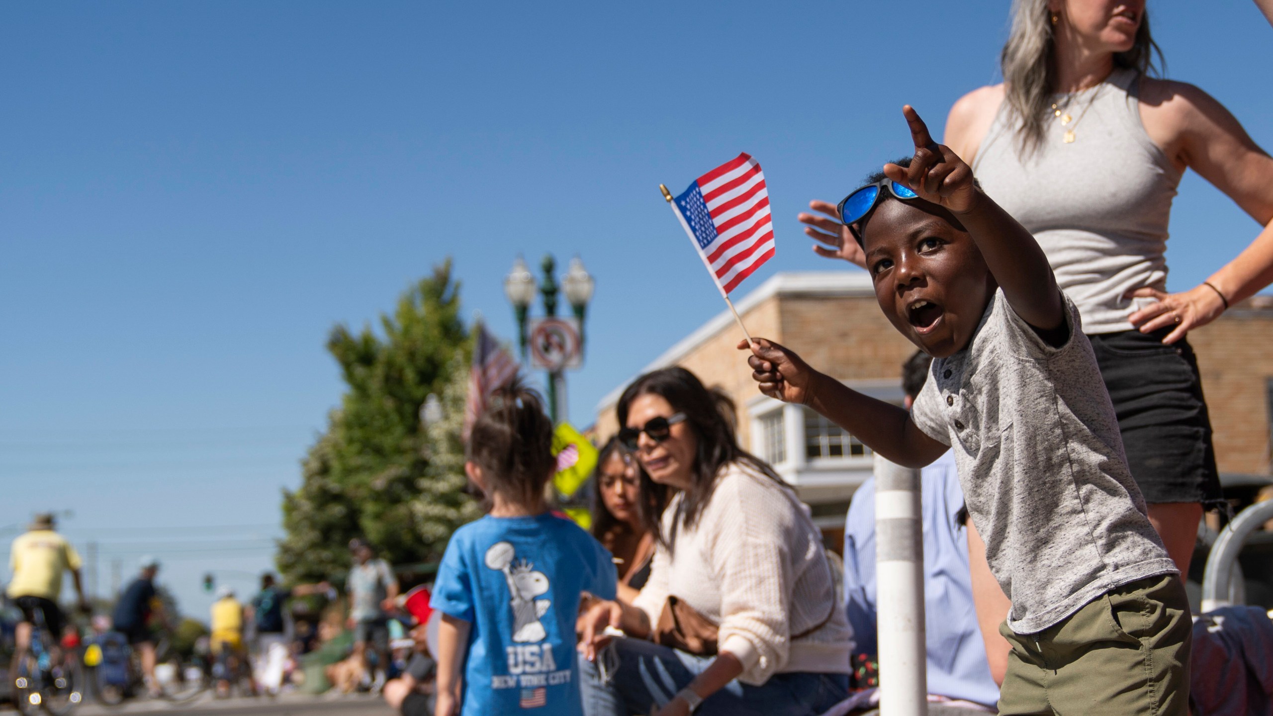 Asa Walden, 4, looks in awe as he waves an American flag during the annual Fourth of July Parade in Alameda, Calif. on Thursday, July 4, 2024. (Minh Connors/San Francisco Chronicle via AP)