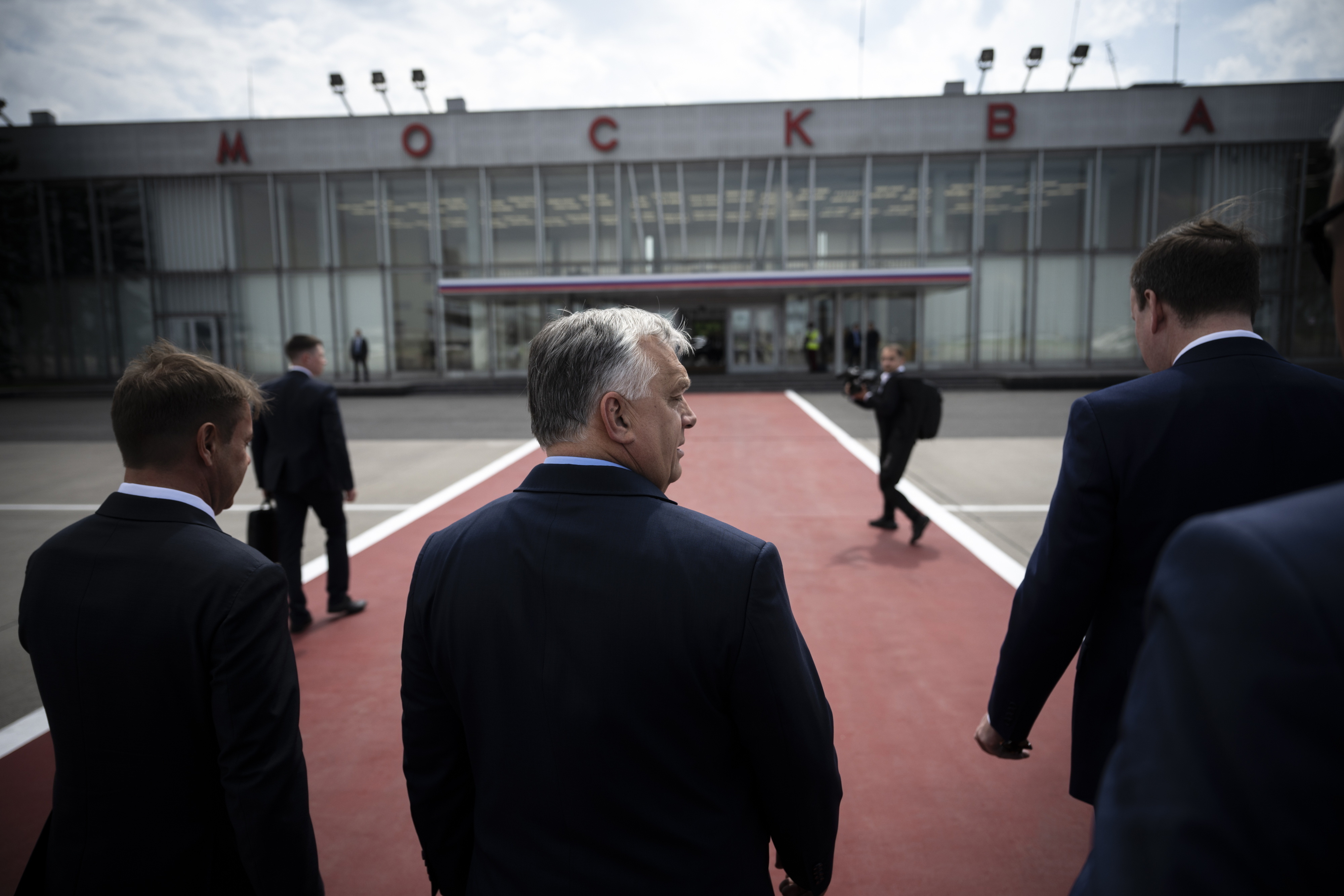 In this picture provided by the Hungarian Prime Minister's Press Office, Hungarian Prime Minister Viktor Orban, center, arrives in Moscow, Russia, Friday, July 5, 2024. Orbán has arrived in Moscow for talks with Russian President Vladimir Putin, Orbán’s press chief said Friday, a rare visit to Russia by a European leader since it invaded Ukraine more than two years ago. (Vivien Cher Benko/Hungarian PM's Press Office/MTI via AP)