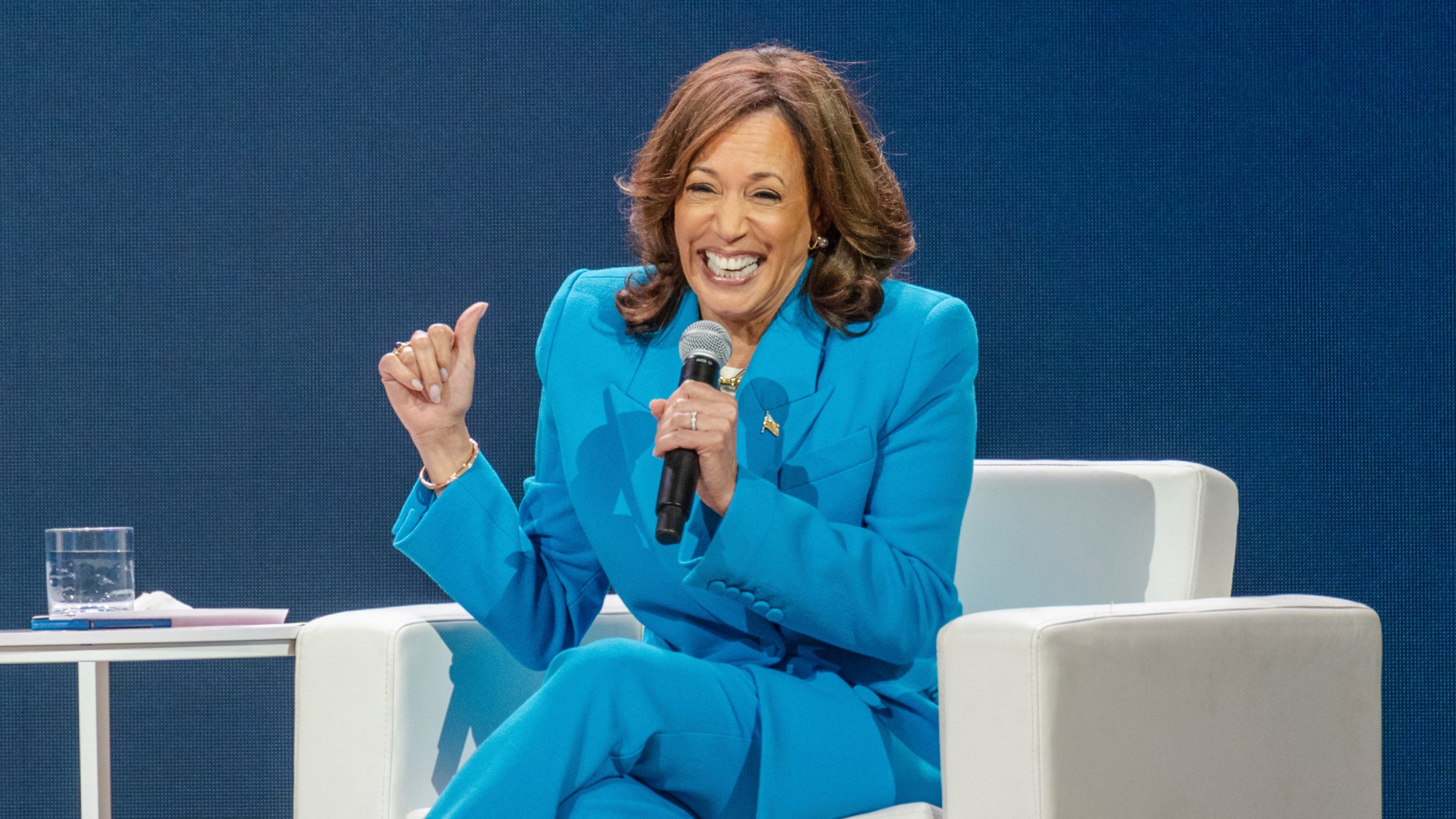 Vice President Kamala Harris laughs during a conversation with Essence CEO Caroline Wanga during the 30th annual Essence Festival of Culture in New Orleans, Saturday, July 6, 2024. (Matthew Perschall/The Times-Picayune/The New Orleans Advocate via AP)