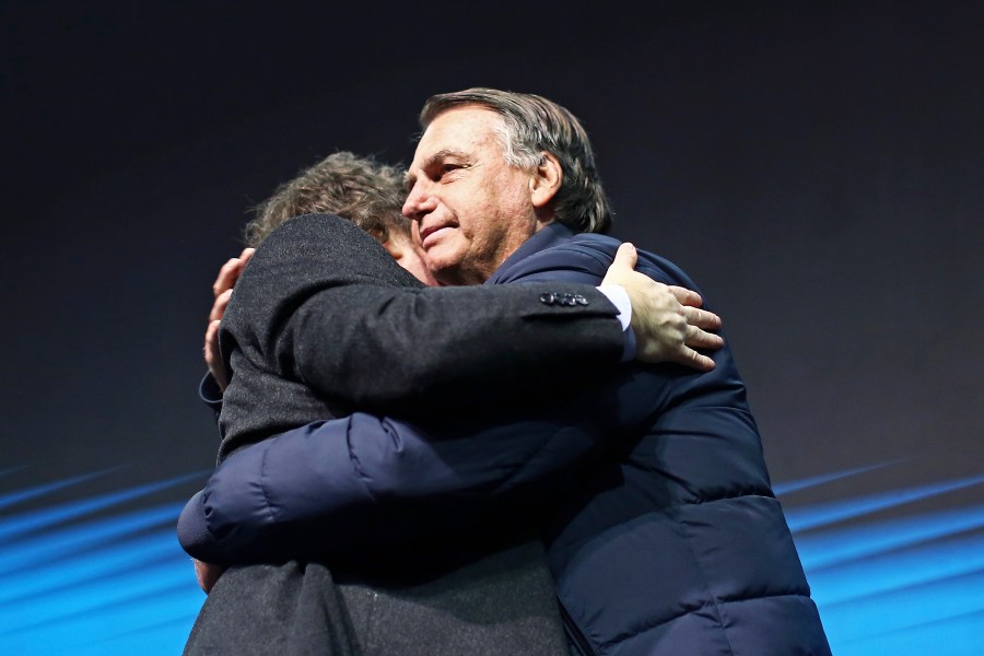 Brazil's former President Jair Bolsonaro, right, hugs Argentina's President Javier Milei at CPAC Brasil 2024, a conservative event, in Balneario Camboriu, Santa Catarina state, Brazil, Sunday, July 7, 2024. (AP Photo/Heuler Andrey)