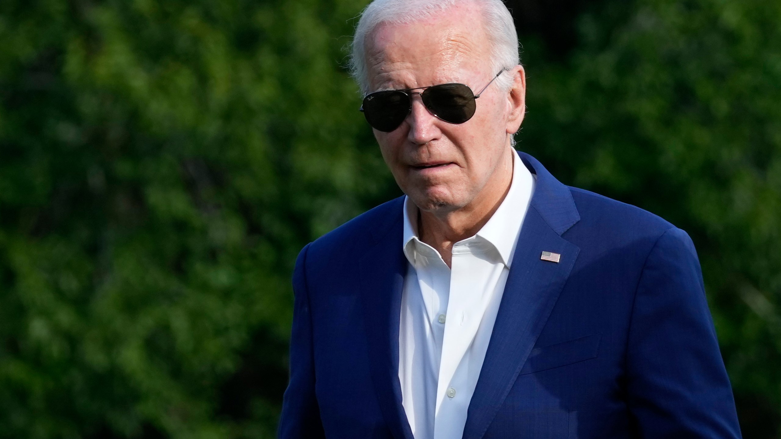 President Joe Biden walks across the South Lawn of the White House in Washington, Sunday, July 7, 2024, after returning from a trip to Pennsylvania. (AP Photo/Susan Walsh)