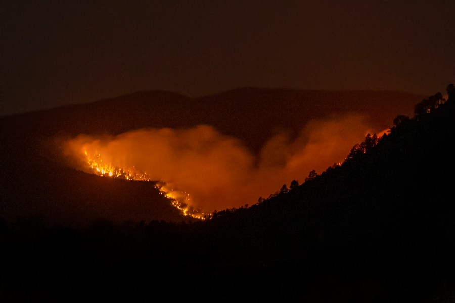 FILE - The Hermits Peak-Calf Canyon Fire burns south of Las Vegas, N.M., Saturday, May 7, 2022. Two years after the U.S. Forest Service sparked what would become the largest and most destructive wildfire in New Mexico’s recorded history, independent investigators say there are gaps that need to be addressed if the agency is to be successful at using prescribed fire as a tool to reduce risk amid climate change. (Robert Browman/The Albuquerque Journal via AP, File)