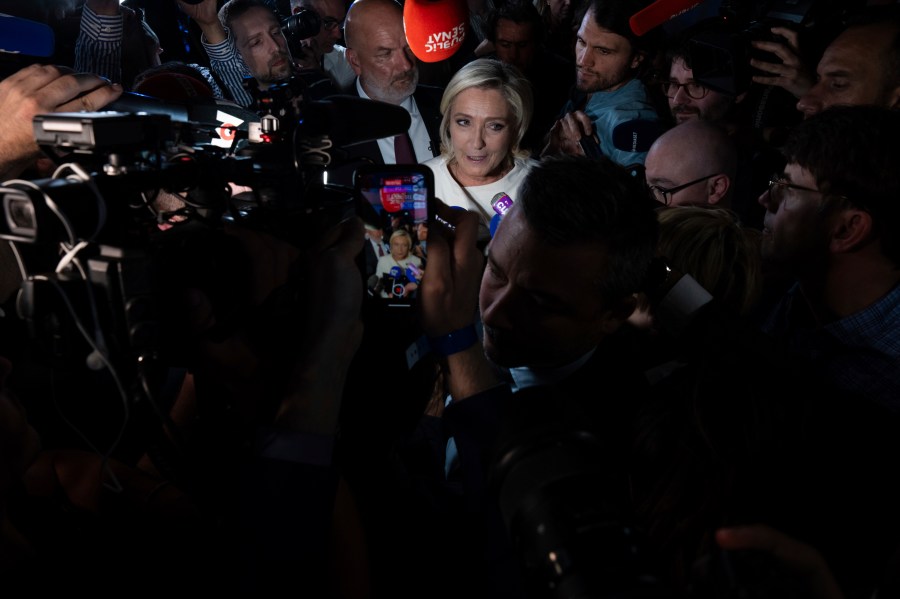 Far-right National Rally party leader Marine Le Pen answers reporters after the second round of the legislative election, Sunday, July 7, 2024, at the party election night headquarters in Paris. A coalition on the left that came together unexpectedly ahead of France's snap elections won the most parliamentary seats in the vote, according to polling projections Sunday. The surprise projections put President Emmanuel Macron's centrist alliance in second and the far right in third. (AP Photo/Louise Delmotte)