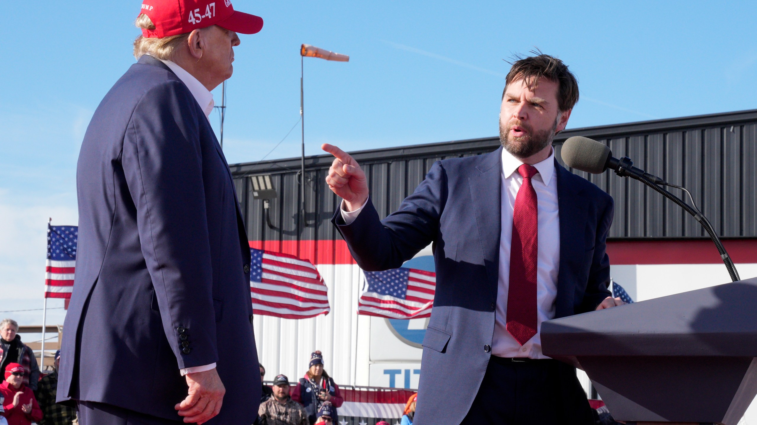 FILE - Sen. J.D. Vance, R-Ohio, right, points toward Republican presidential candidate former President Donald Trump at a campaign rally, March 16, 2024, in Vandalia, Ohio. Vance is a top contender to be selected as Trump's running mate. (AP Photo/Jeff Dean, File)